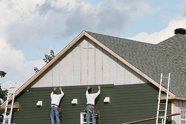 Professional Siding Contractor technician working in Westbury, NY